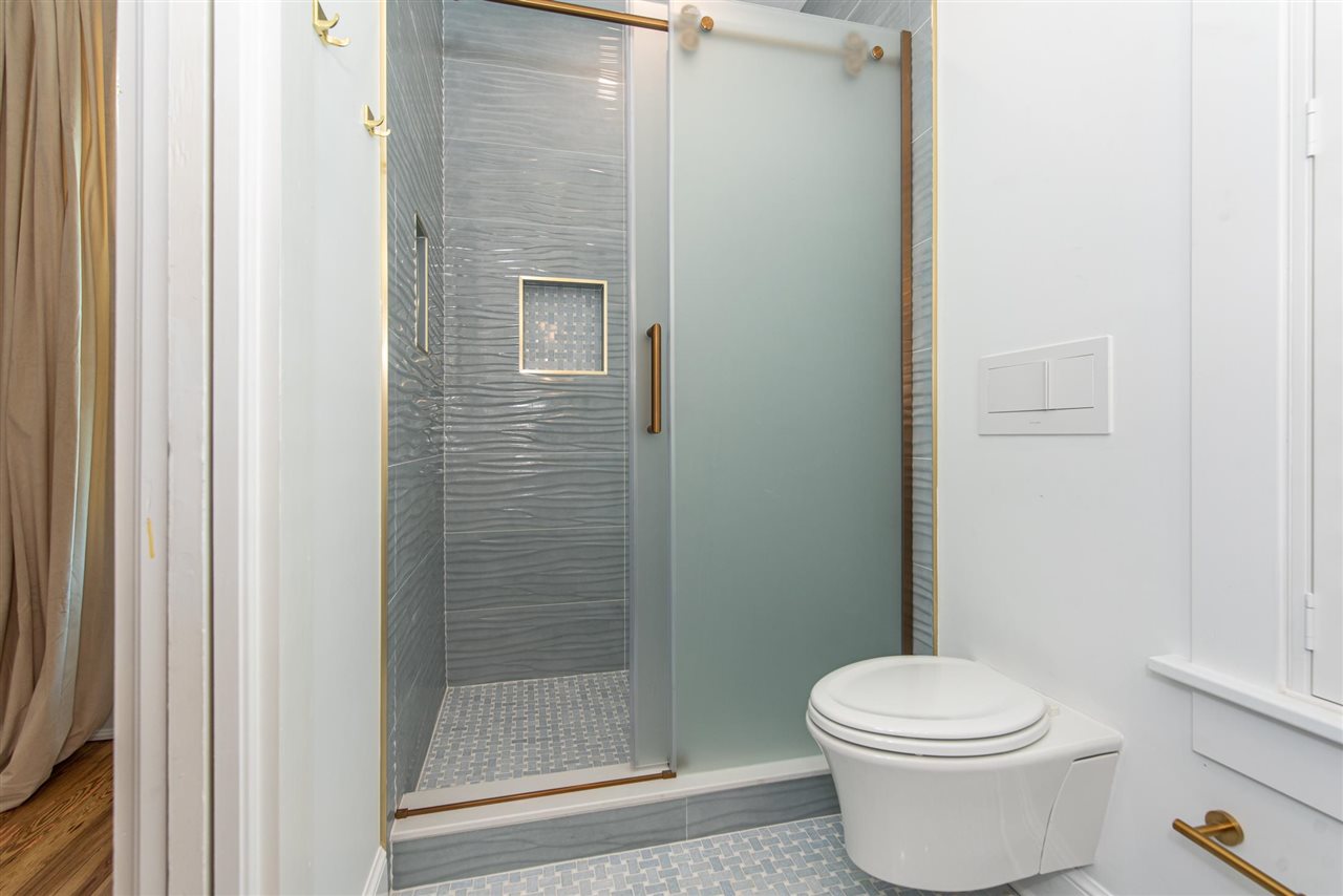 21 Saragossa Street St. Augustine, FL 32084 - Photo 32 of 46 a bathroom with a toilet and a shower