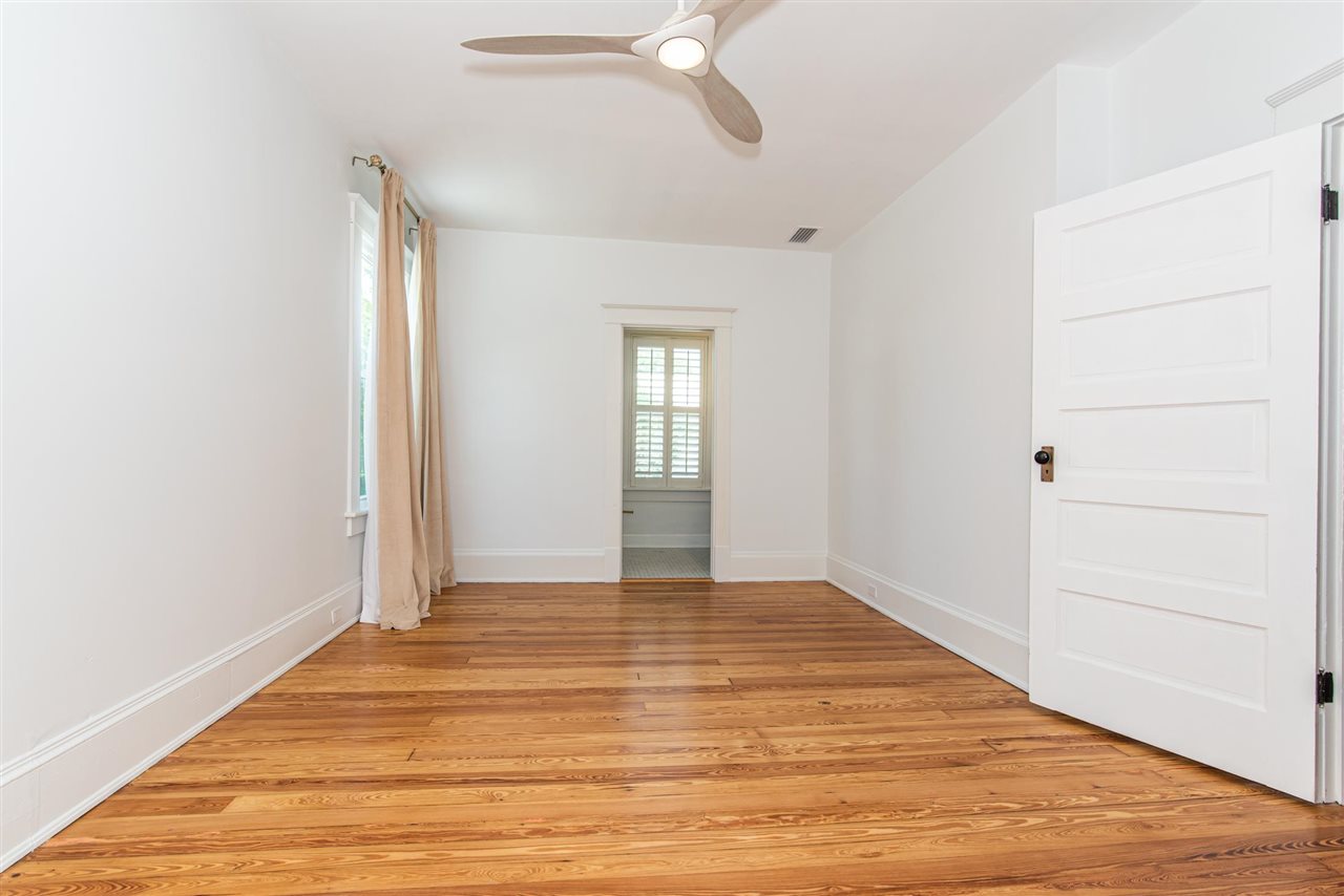21 Saragossa Street St. Augustine, FL 32084 - Photo 34 of 46 a view of an empty room with wooden floor and fan