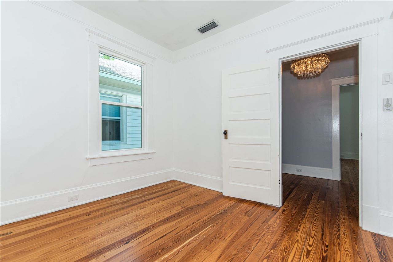 21 Saragossa Street St. Augustine, FL 32084 - Photo 35 of 46 an empty room with wooden floor closet and windows