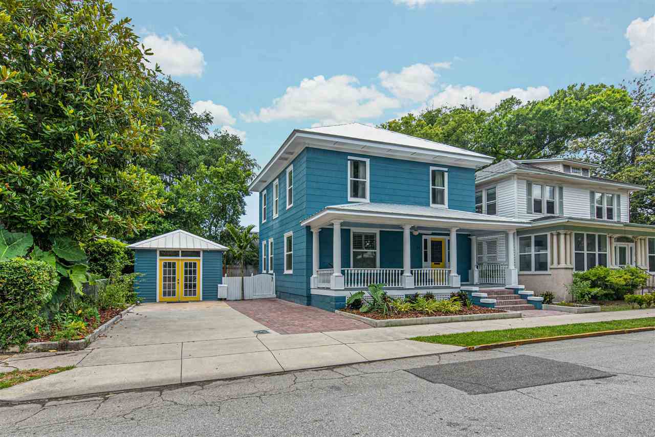21 Saragossa Street St. Augustine, FL 32084 - Photo 45 of 46 a front view of a house with a yard and trees