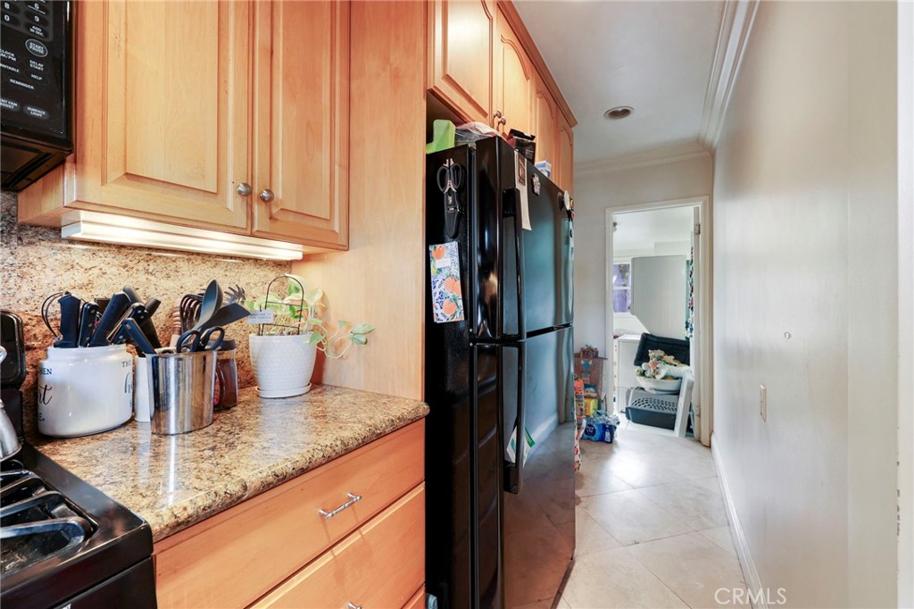 415 Cortez Road Arcadia, CA 91007 - Photo 11 of 27 a kitchen with refrigerator and cabinets