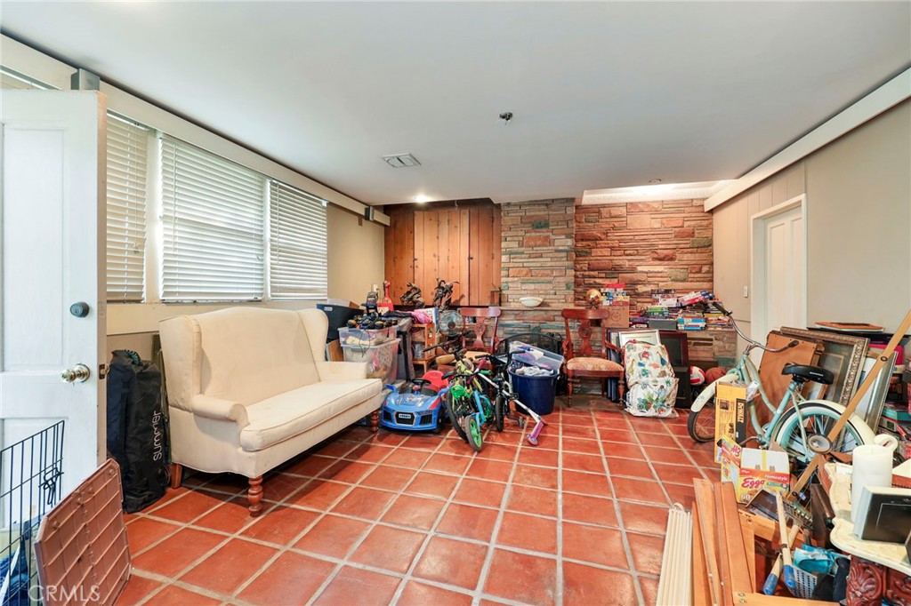 415 Cortez Road Arcadia, CA 91007 - Photo 14 of 27 a living room with patio furniture and a large window