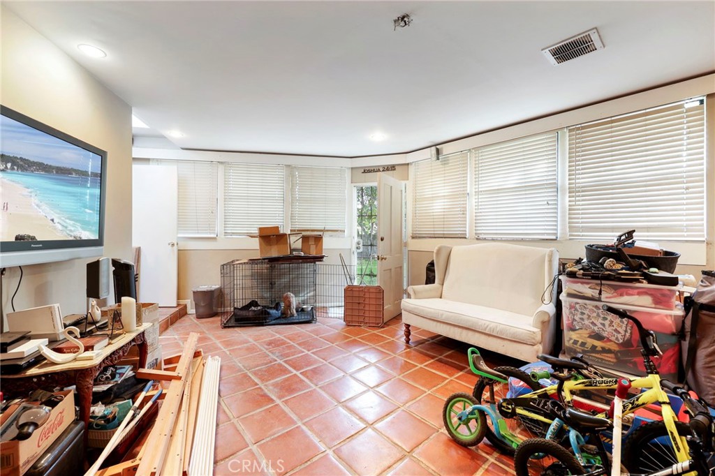 415 Cortez Road Arcadia, CA 91007 - Photo 15 of 27 a living room with furniture and a flat screen tv
