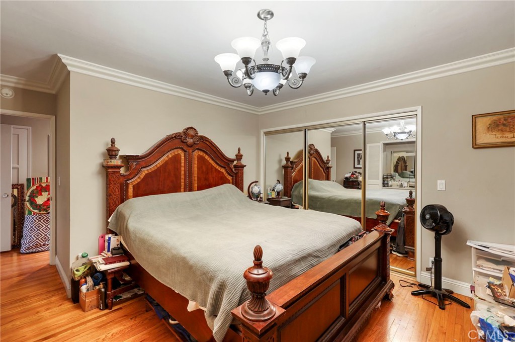 415 Cortez Road Arcadia, CA 91007 - Photo 17 of 27 a bedroom with bed and wooden floor