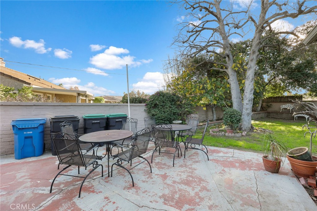 415 Cortez Road Arcadia, CA 91007 - Photo 27 of 27 a view of a patio with a table and chairs under an umbrella