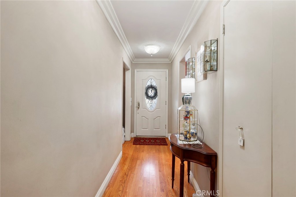 415 Cortez Road Arcadia, CA 91007 - Photo 4 of 27 a view of a hallway with wooden floor