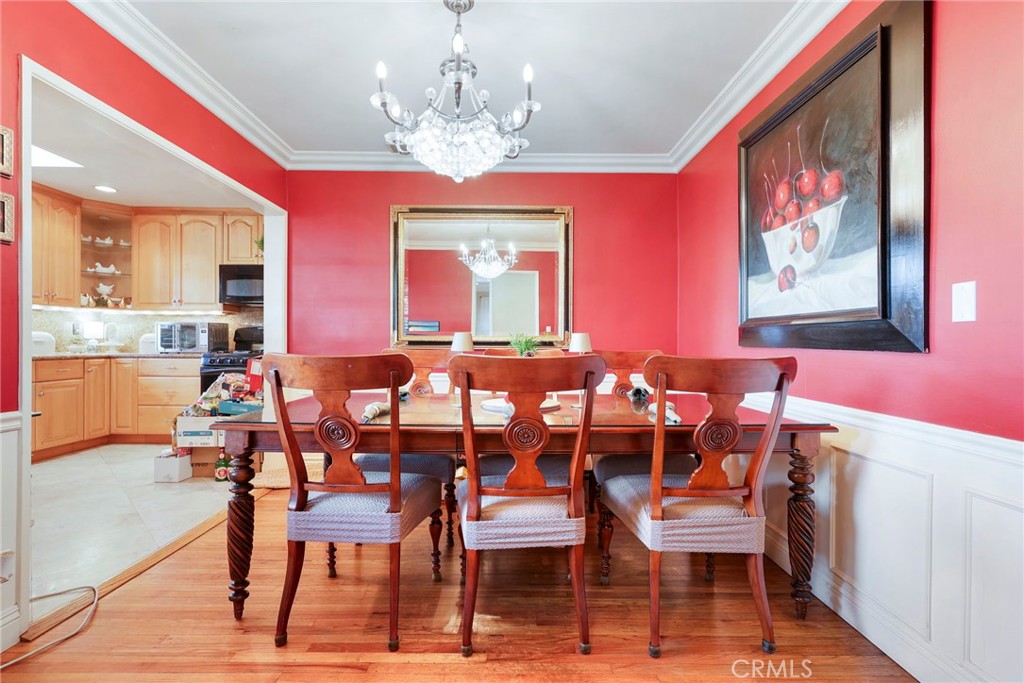415 Cortez Road Arcadia, CA 91007 - Photo 7 of 27 a view of a dining room with furniture and a chandelier