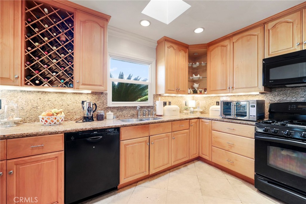 415 Cortez Road Arcadia, CA 91007 - Photo 9 of 27 a kitchen with a sink stove and microwave
