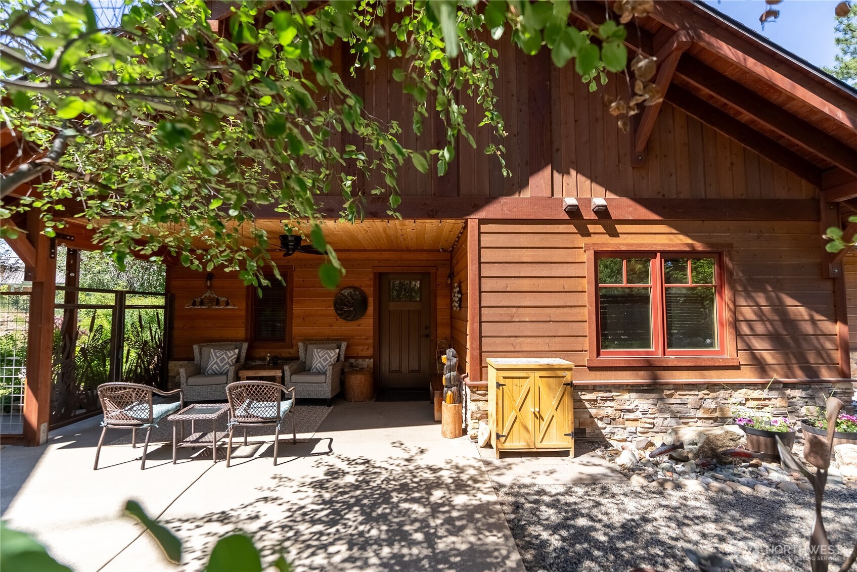 130 Sundown Road Winthrop, WA 98862 - Photo 24 of 40 a patio with table and chairs and potted plants