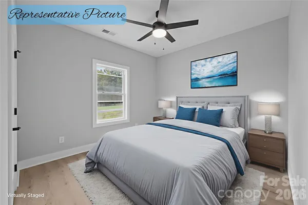 a bedroom with bed and window