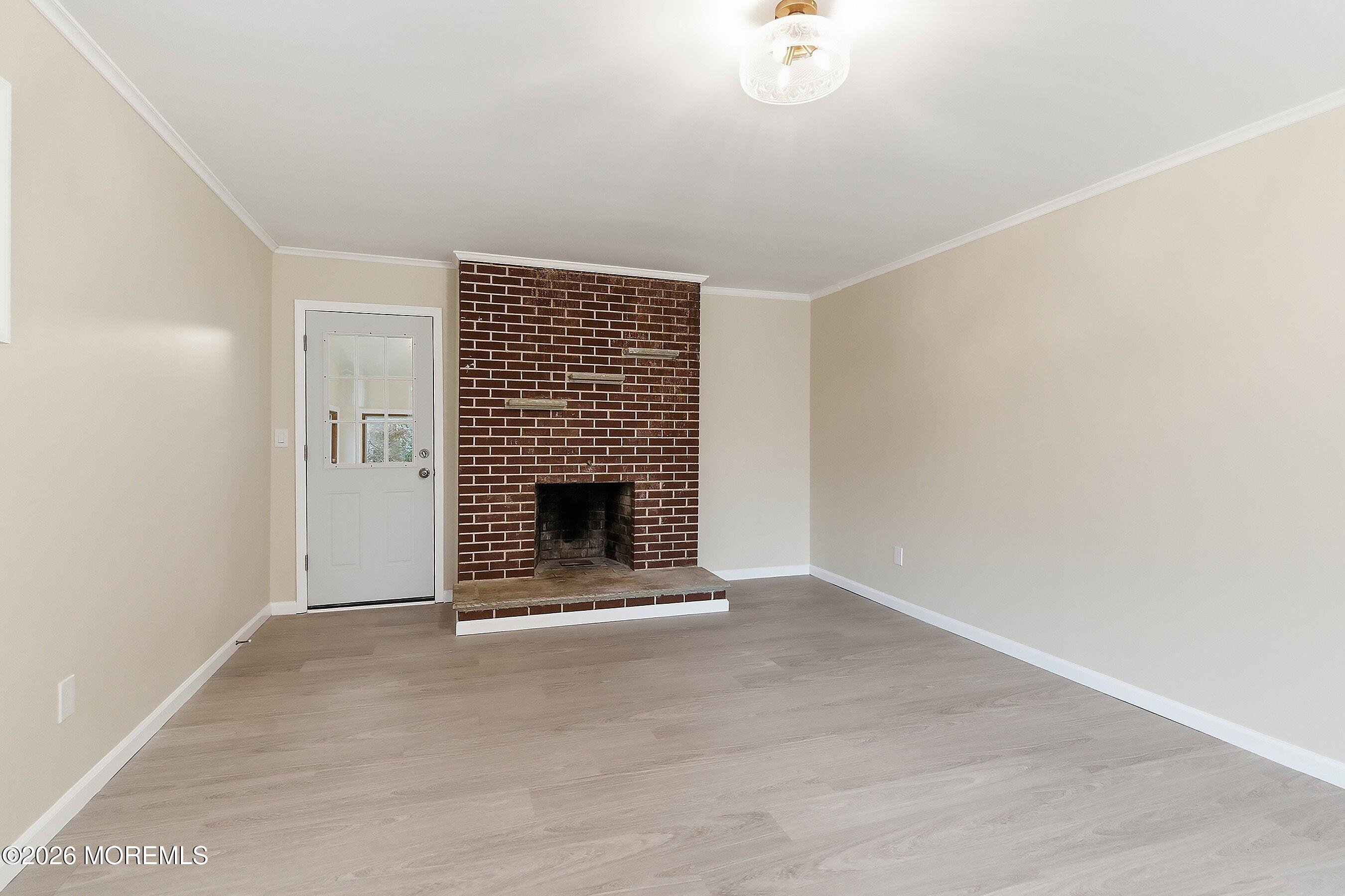 2710 Johnson Street Wall, NJ 07719 - Photo 16 of 38 a view of an empty room with a fireplace