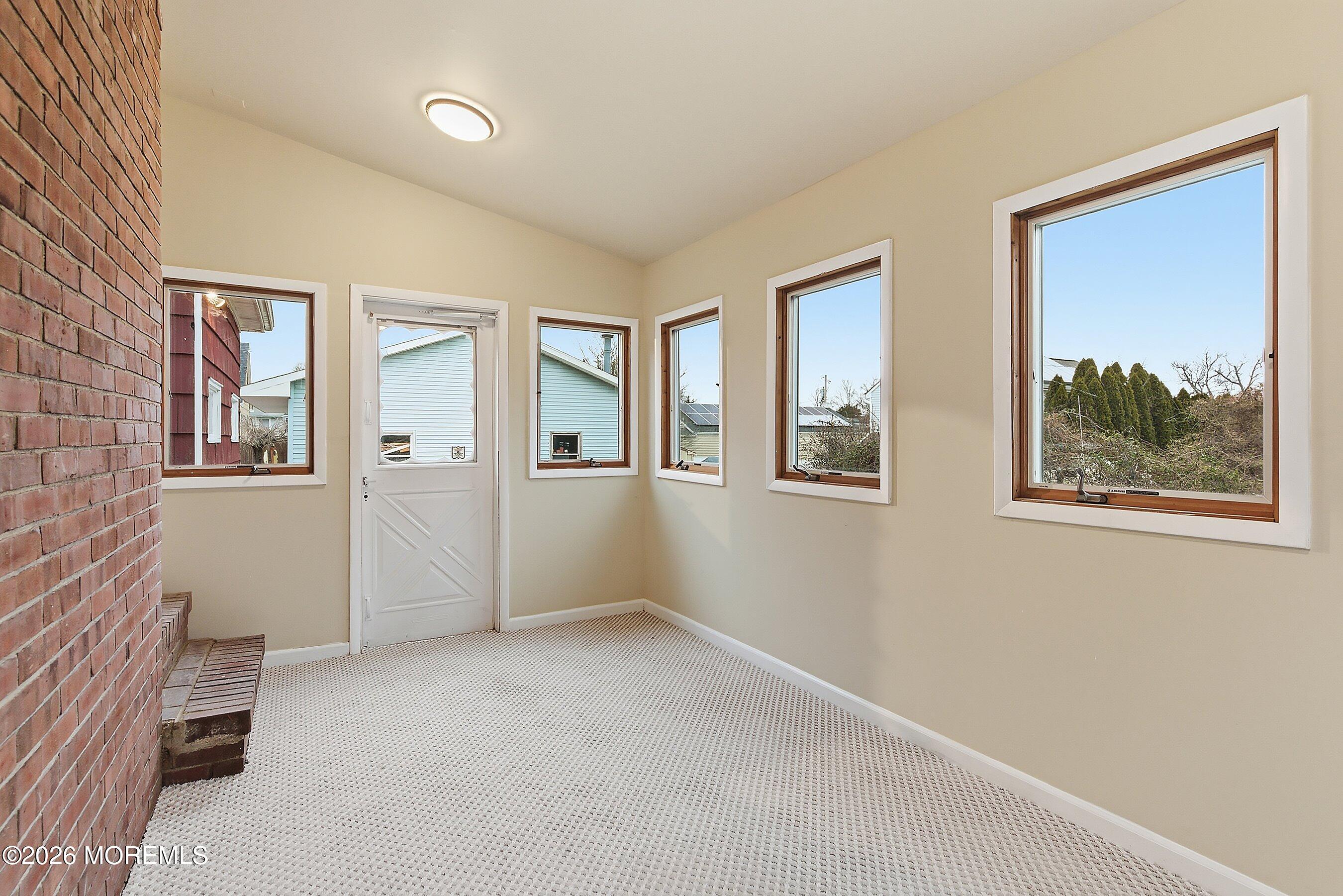 2710 Johnson Street Wall, NJ 07719 - Photo 18 of 38 an empty room with windows and closet