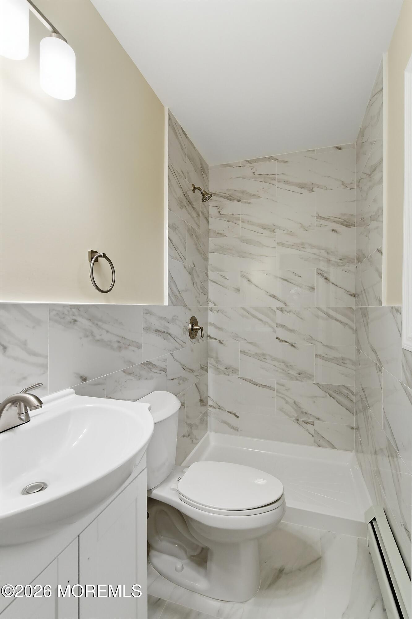 2710 Johnson Street Wall, NJ 07719 - Photo 23 of 38 a bathroom with a sink a toilet and shower