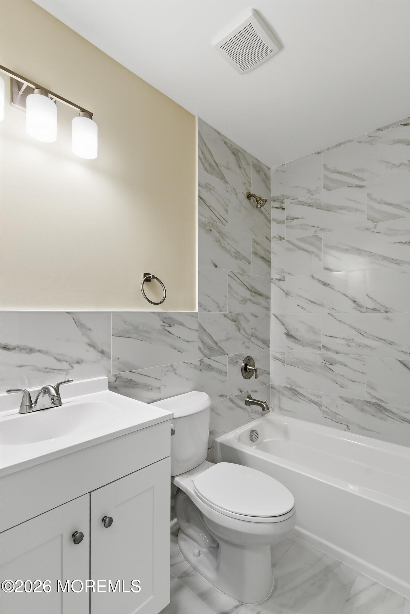 2710 Johnson Street Wall, NJ 07719 - Photo 24 of 38 a bathroom with a sink a toilet and shower