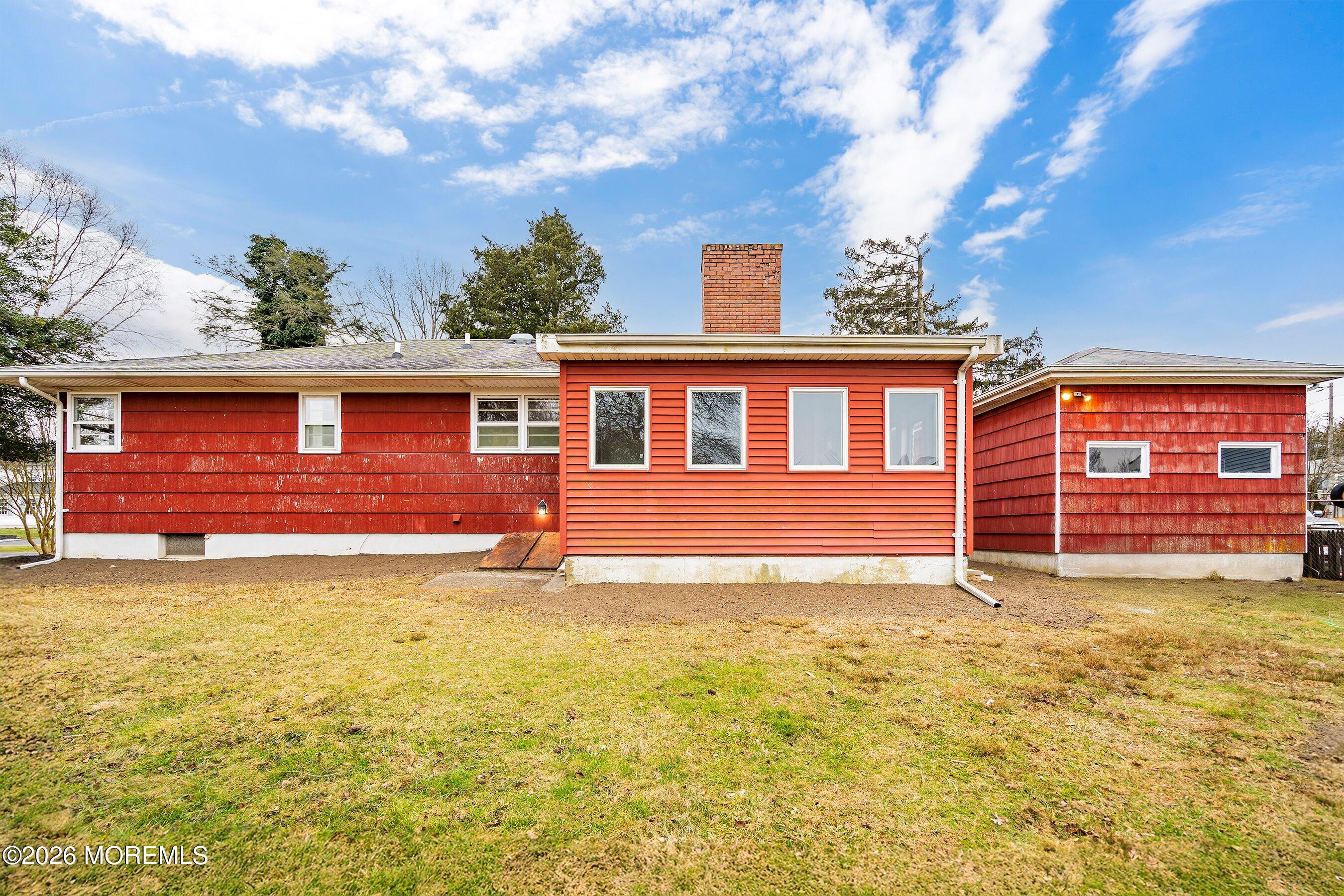 2710 Johnson Street Wall, NJ 07719 - Photo 28 of 38 a view of a house with a backyard