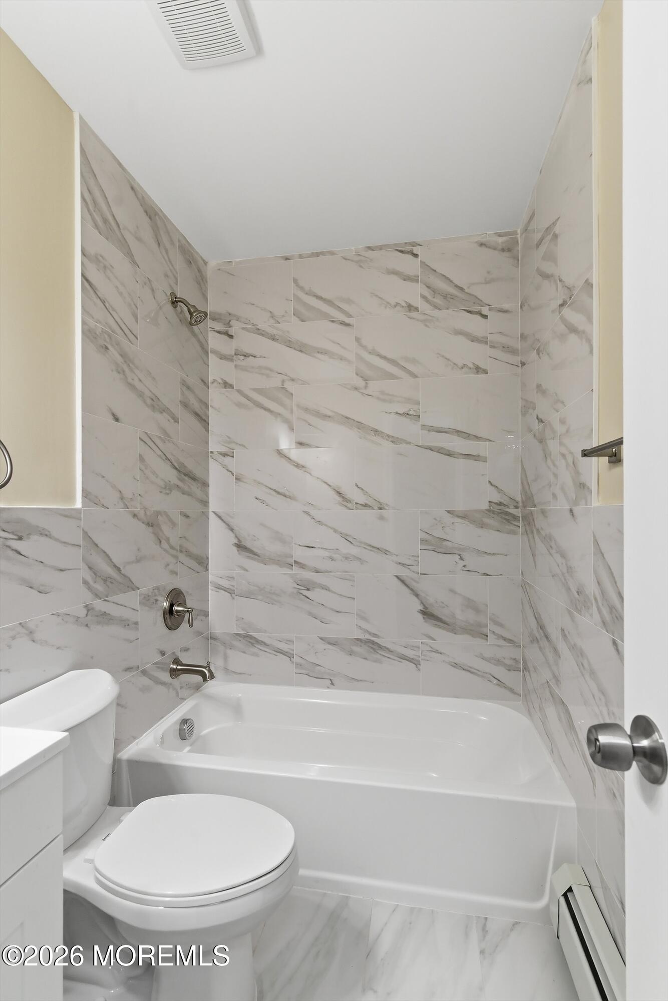 2710 Johnson Street Wall, NJ 07719 - Photo 36 of 38 a bathroom with a toilet and a bathtub