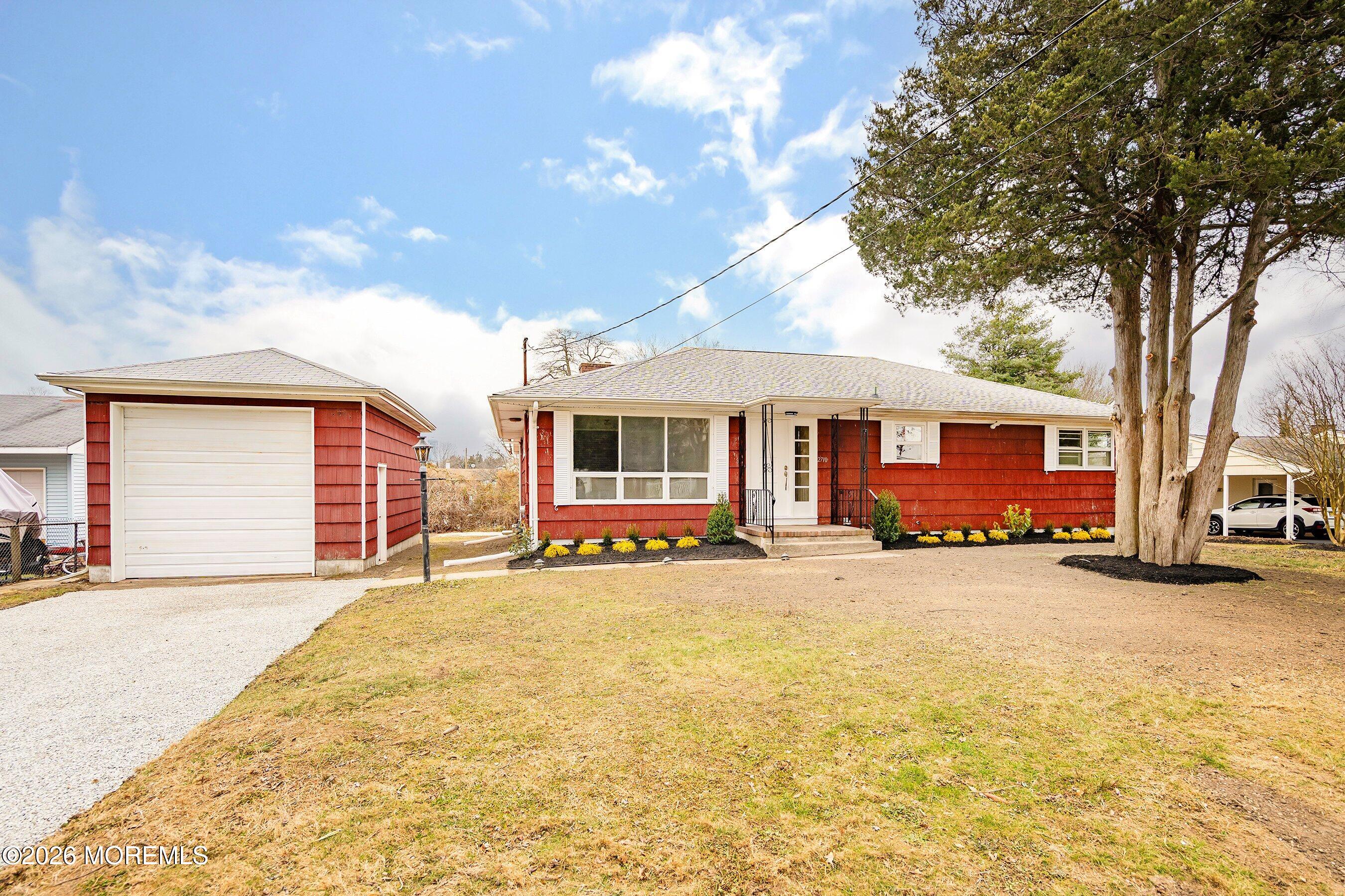 2710 Johnson Street Wall, NJ 07719 - Photo 4 of 38 a view of a house with a yard and large tree