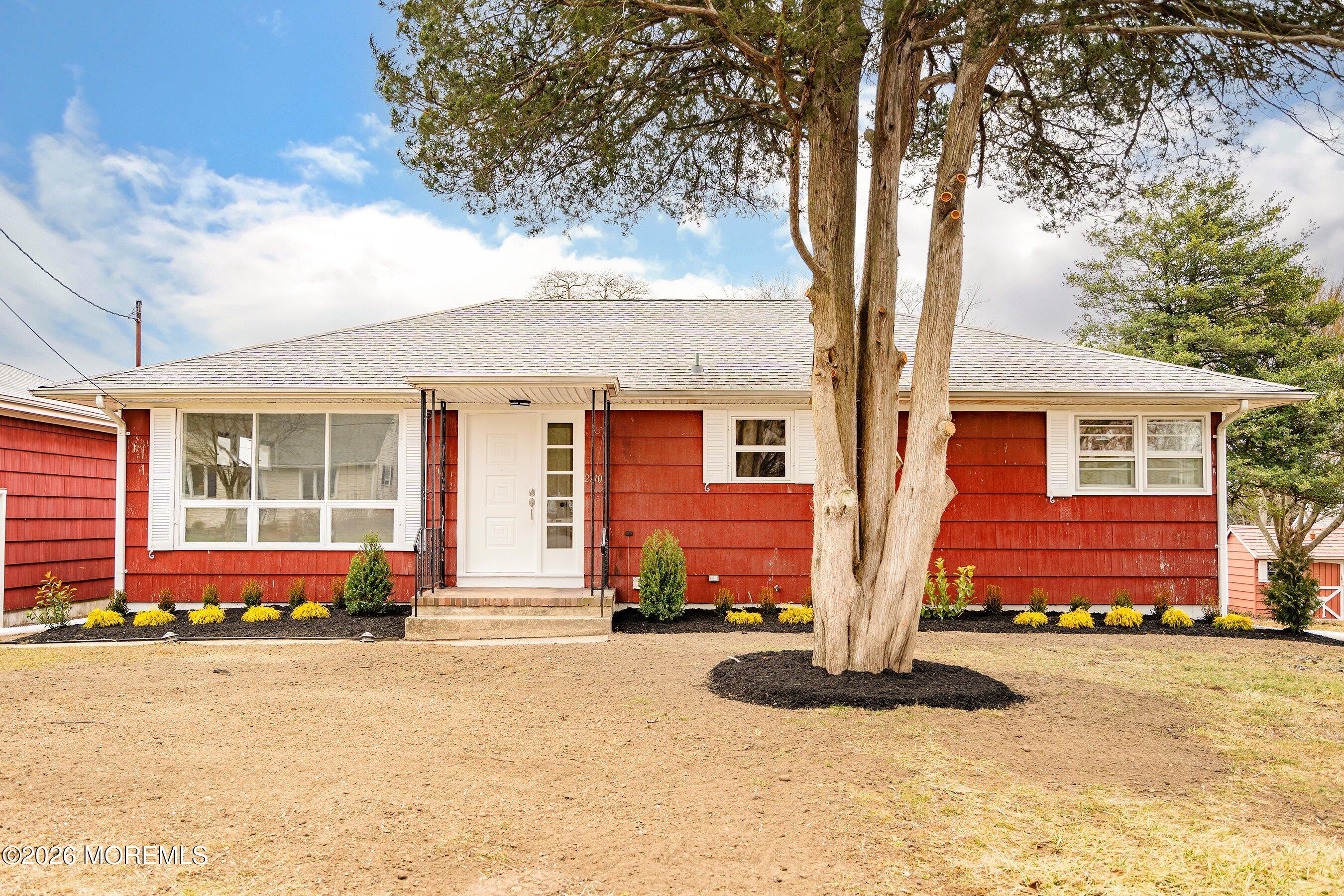 2710 Johnson Street Wall, NJ 07719 - Photo 5 of 38 front view of a house with a patio