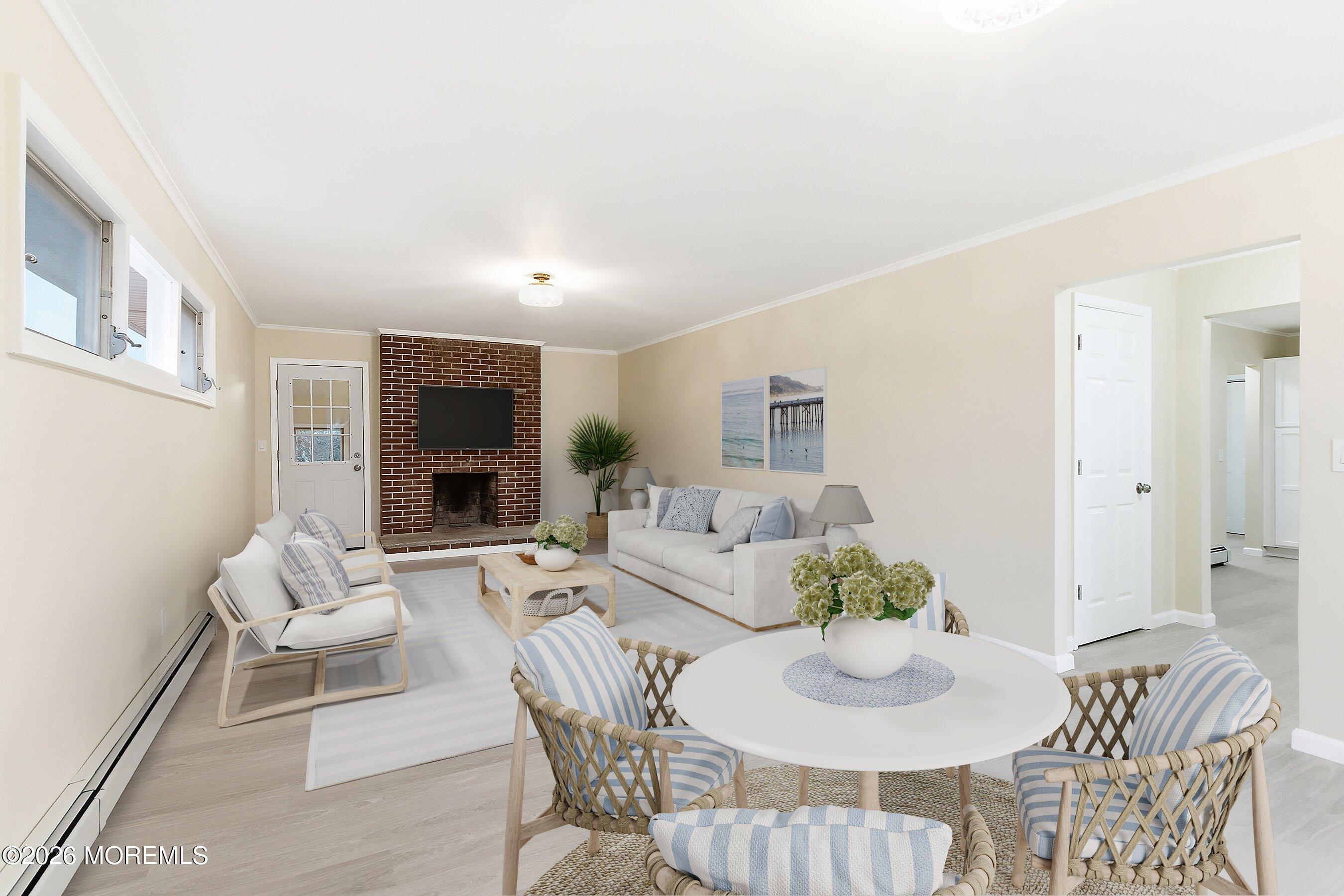 2710 Johnson Street Wall, NJ 07719 - Photo 9 of 38 a living room with furniture a dining table and a fireplace