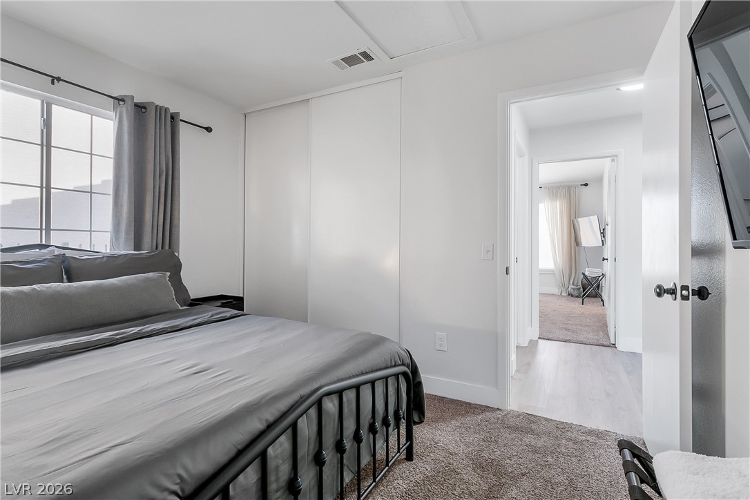 101 Beaver Ridge Avenue North Las Vegas, NV 89031 - Photo 23 of 42 A well-lit bedroom with a wide window and integrated closet storage.