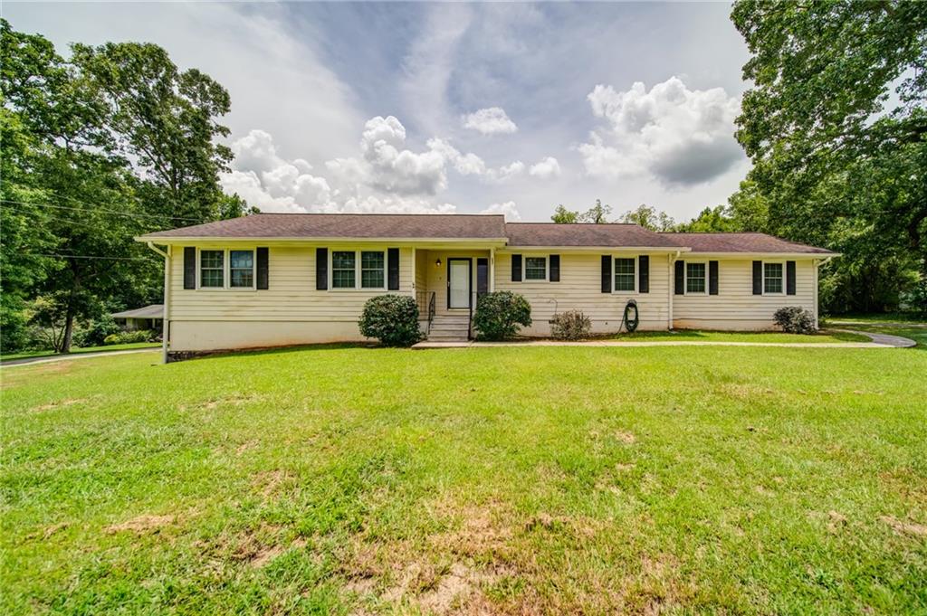 5054 Rex Road Stockbridge, GA 30281 - Photo 1 of 1 a front view of house with yard and green space