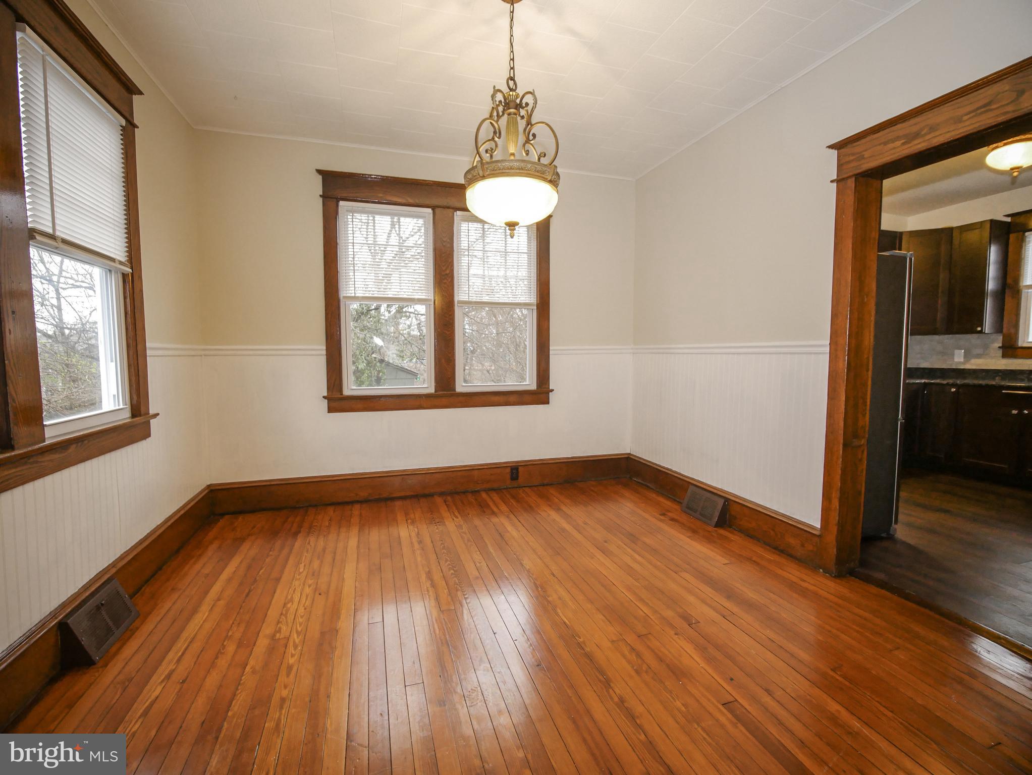 332 Crown Point Road Thorofare, NJ 08086 - Photo 14 of 36 a view of an empty room with wooden floor and a window
