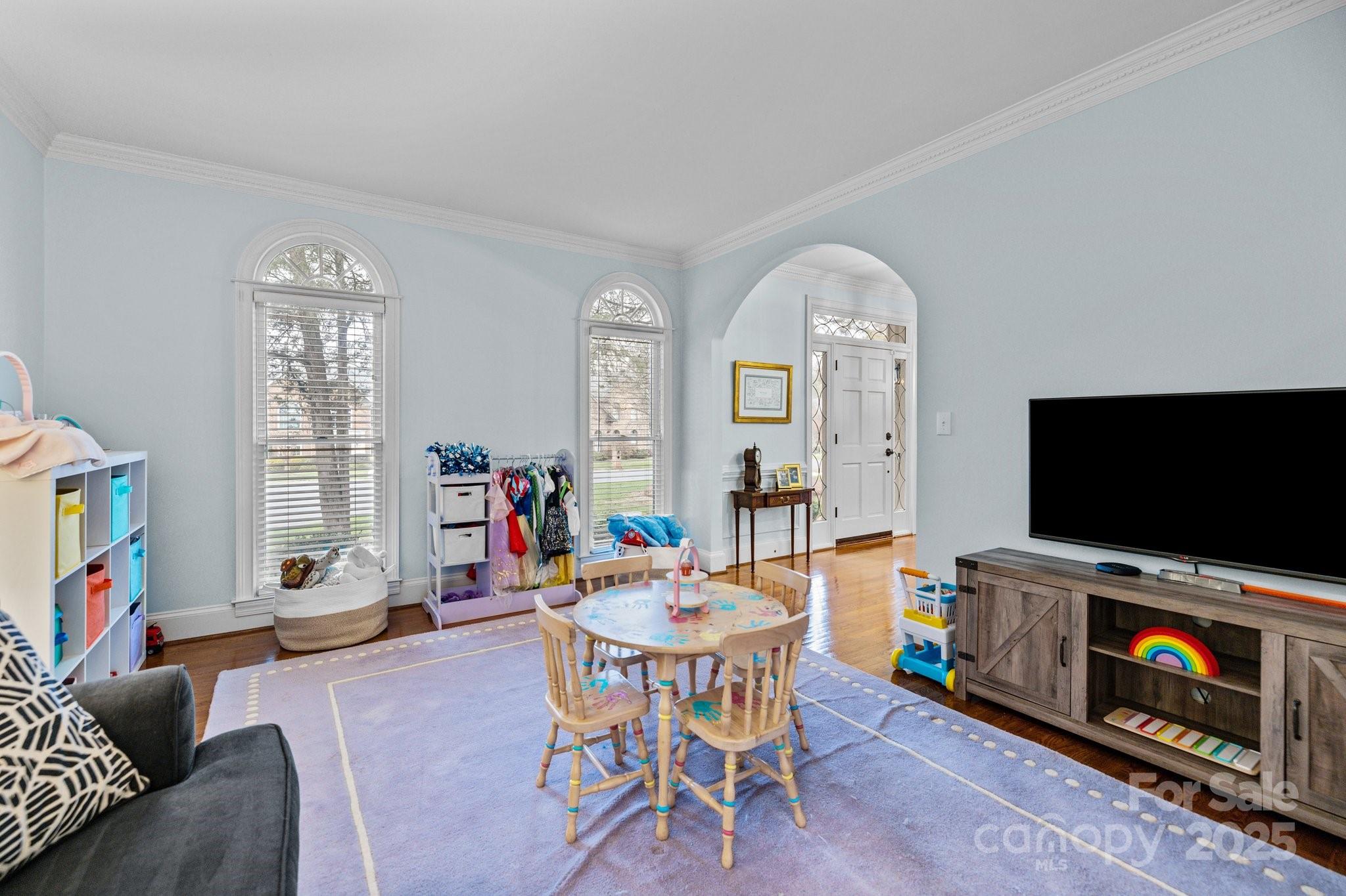 4739 Binfords Ridge Road Charlotte, NC 28226 - Photo 12 of 47 a living room with furniture and a flat screen tv