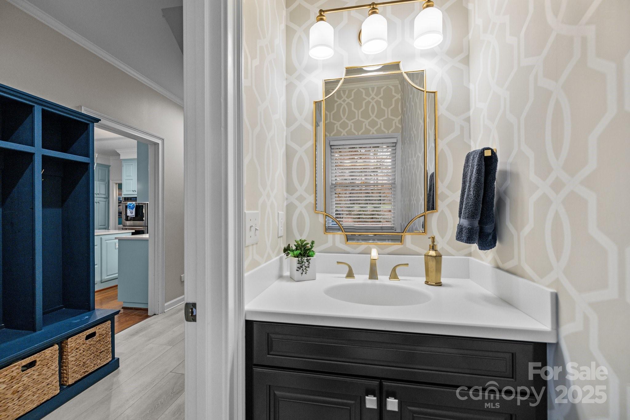 4739 Binfords Ridge Road Charlotte, NC 28226 - Photo 18 of 47 a bathroom with a sink and a mirror