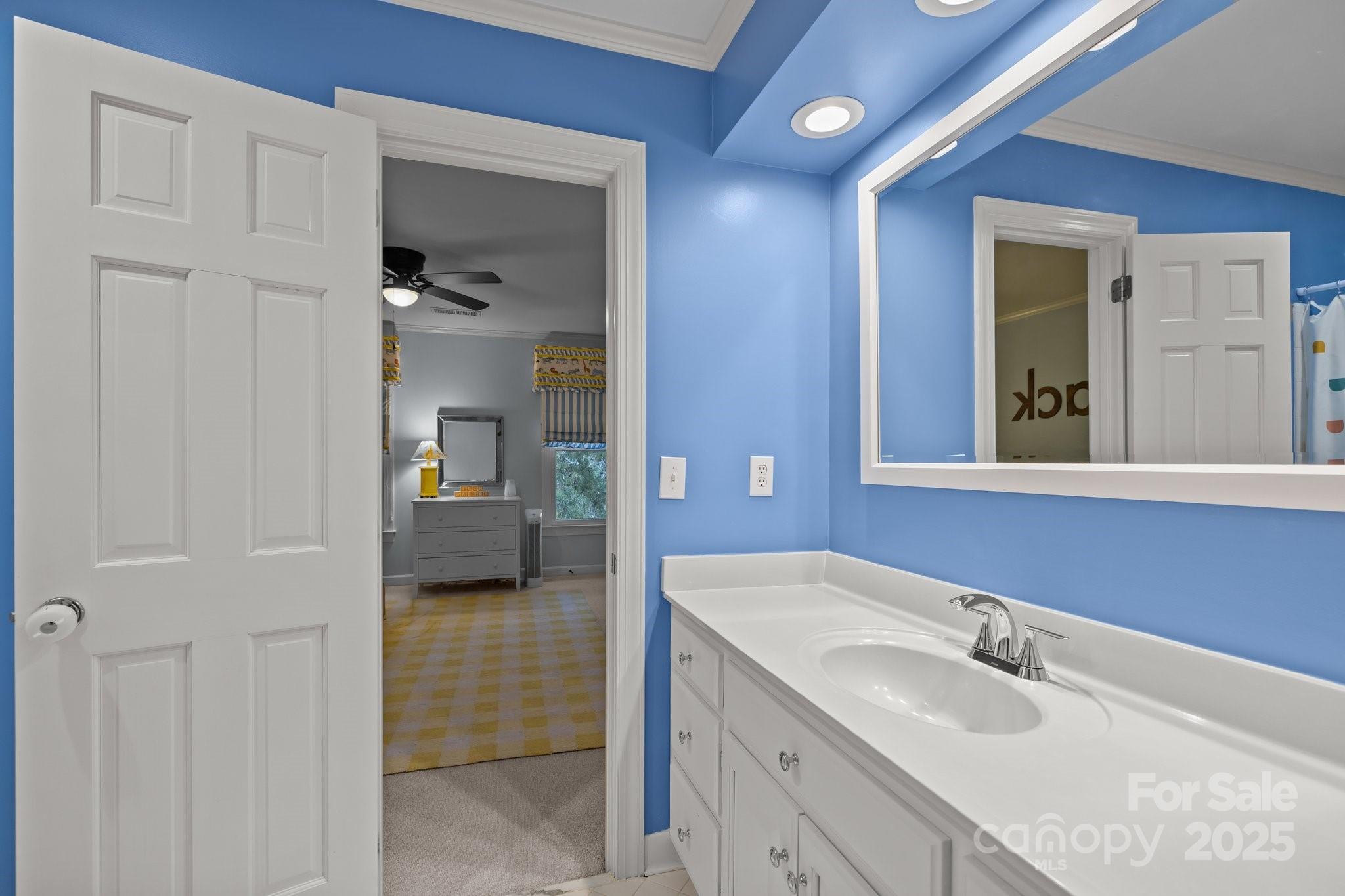 4739 Binfords Ridge Road Charlotte, NC 28226 - Photo 29 of 47 a en suite bathroom with a sink and a mirror