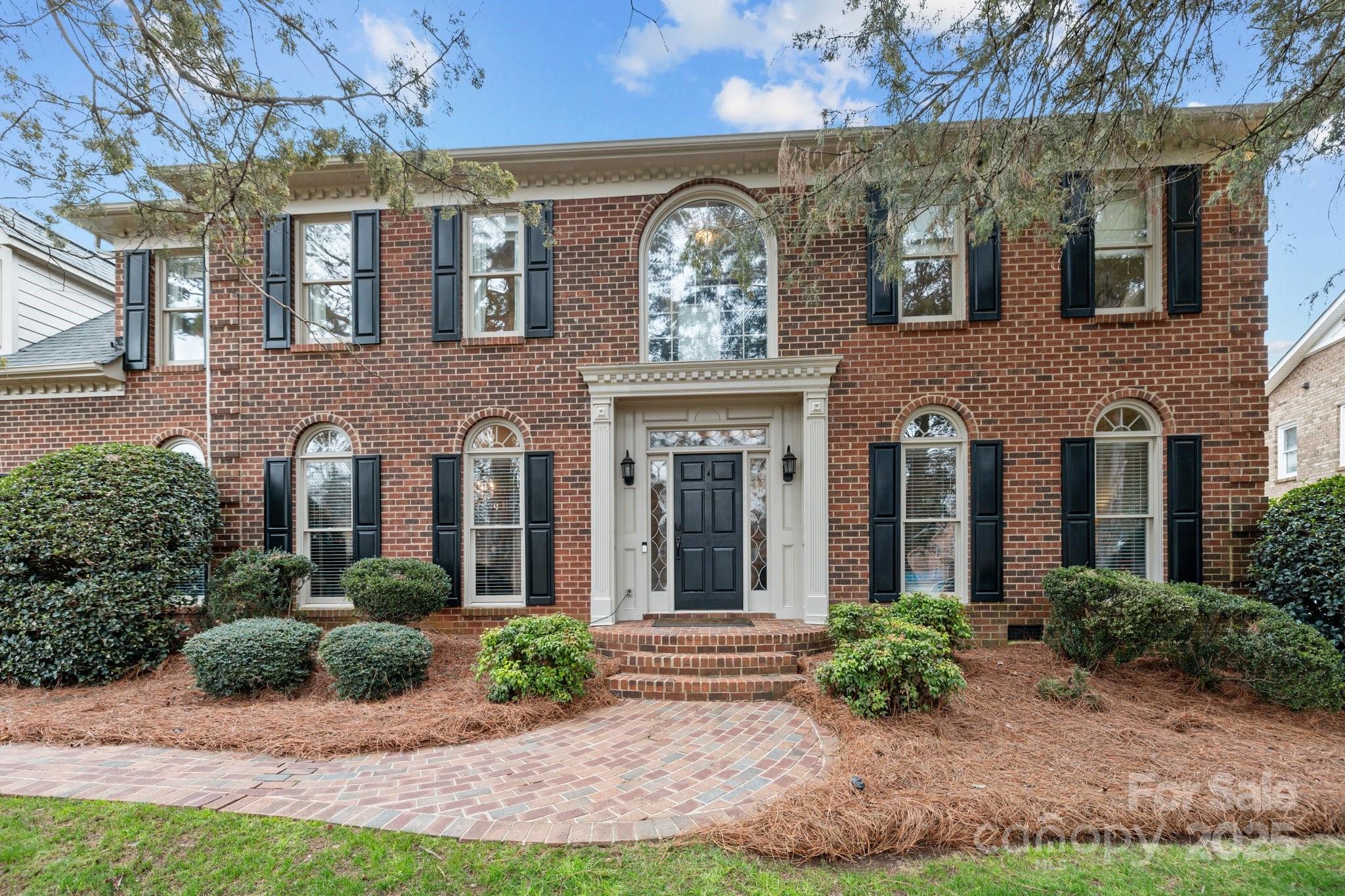 4739 Binfords Ridge Road Charlotte, NC 28226 - Photo 3 of 47 a front view of a house with yard and green space