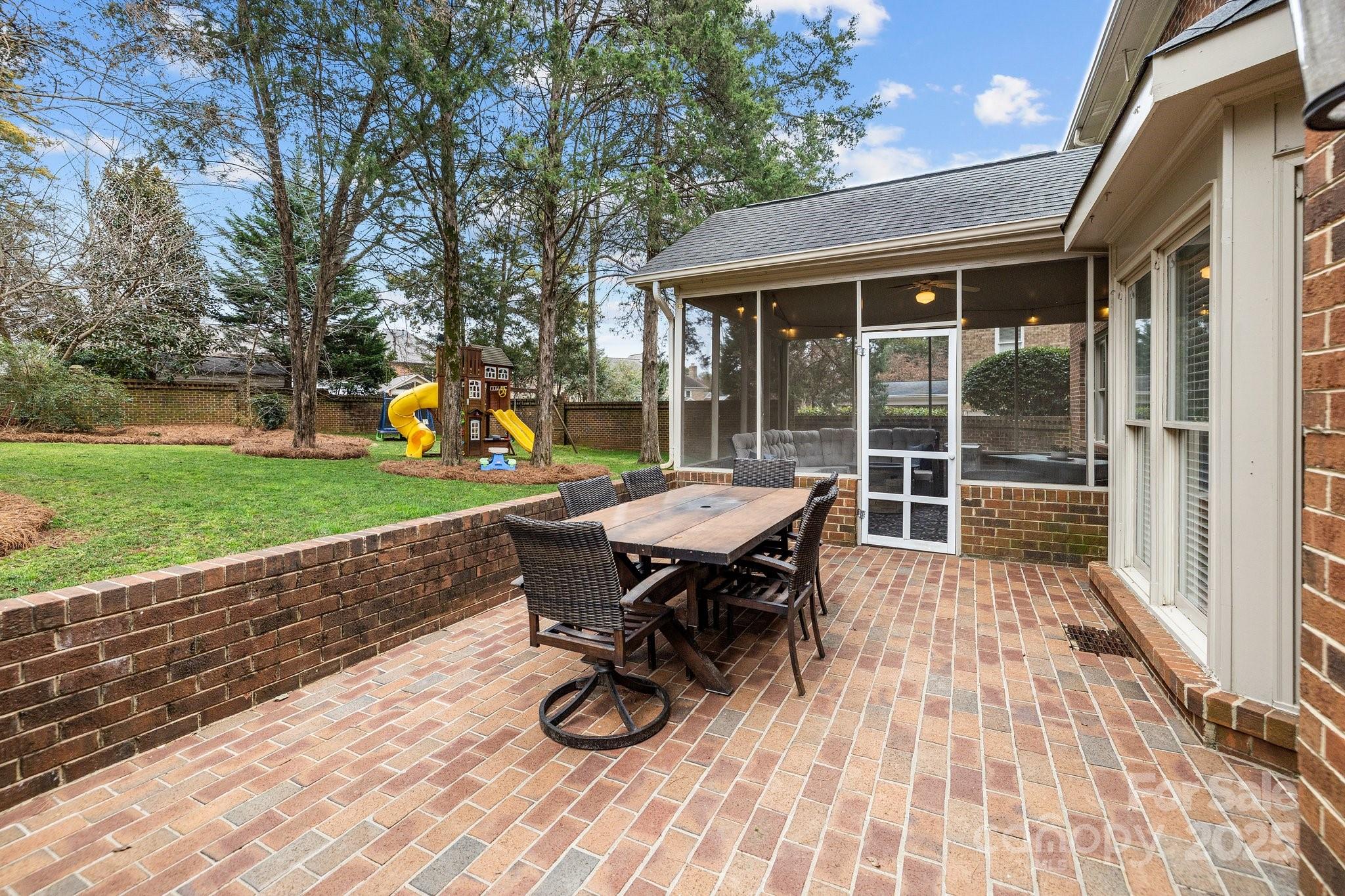 4739 Binfords Ridge Road Charlotte, NC 28226 - Photo 37 of 47 a view of a patio with table and chairs with wooden floor and fence