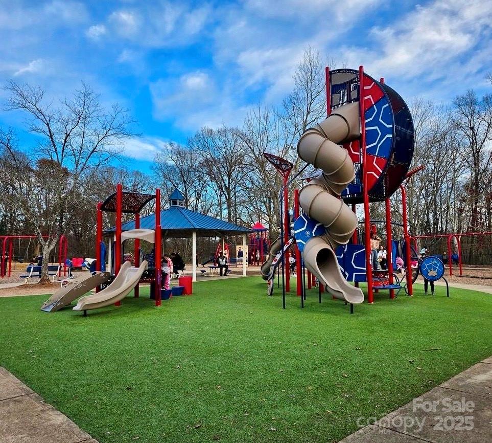 4739 Binfords Ridge Road Charlotte, NC 28226 - Photo 47 of 47 a front view of a building with garden and seating area