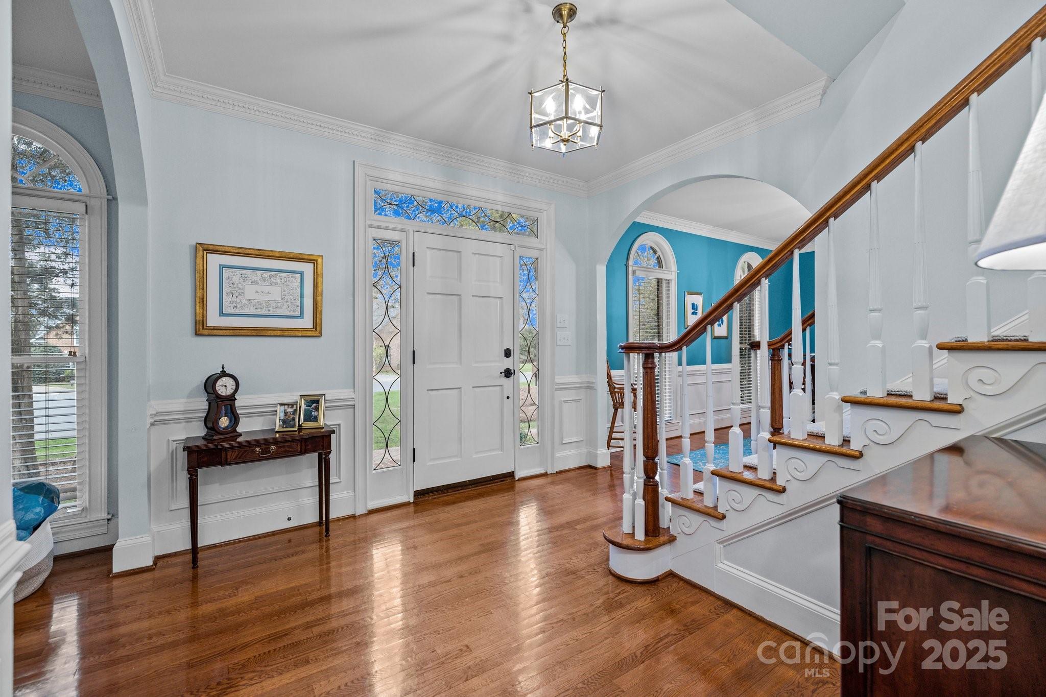 4739 Binfords Ridge Road Charlotte, NC 28226 - Photo 5 of 47 a livingroom with furniture staircase and view of kitchen