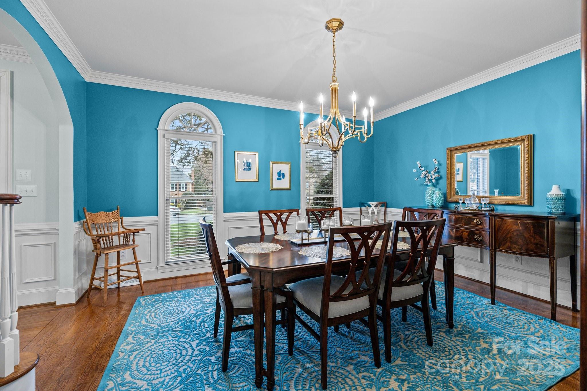 4739 Binfords Ridge Road Charlotte, NC 28226 - Photo 7 of 47 a view of a dining room with furniture wooden floor and chandelier