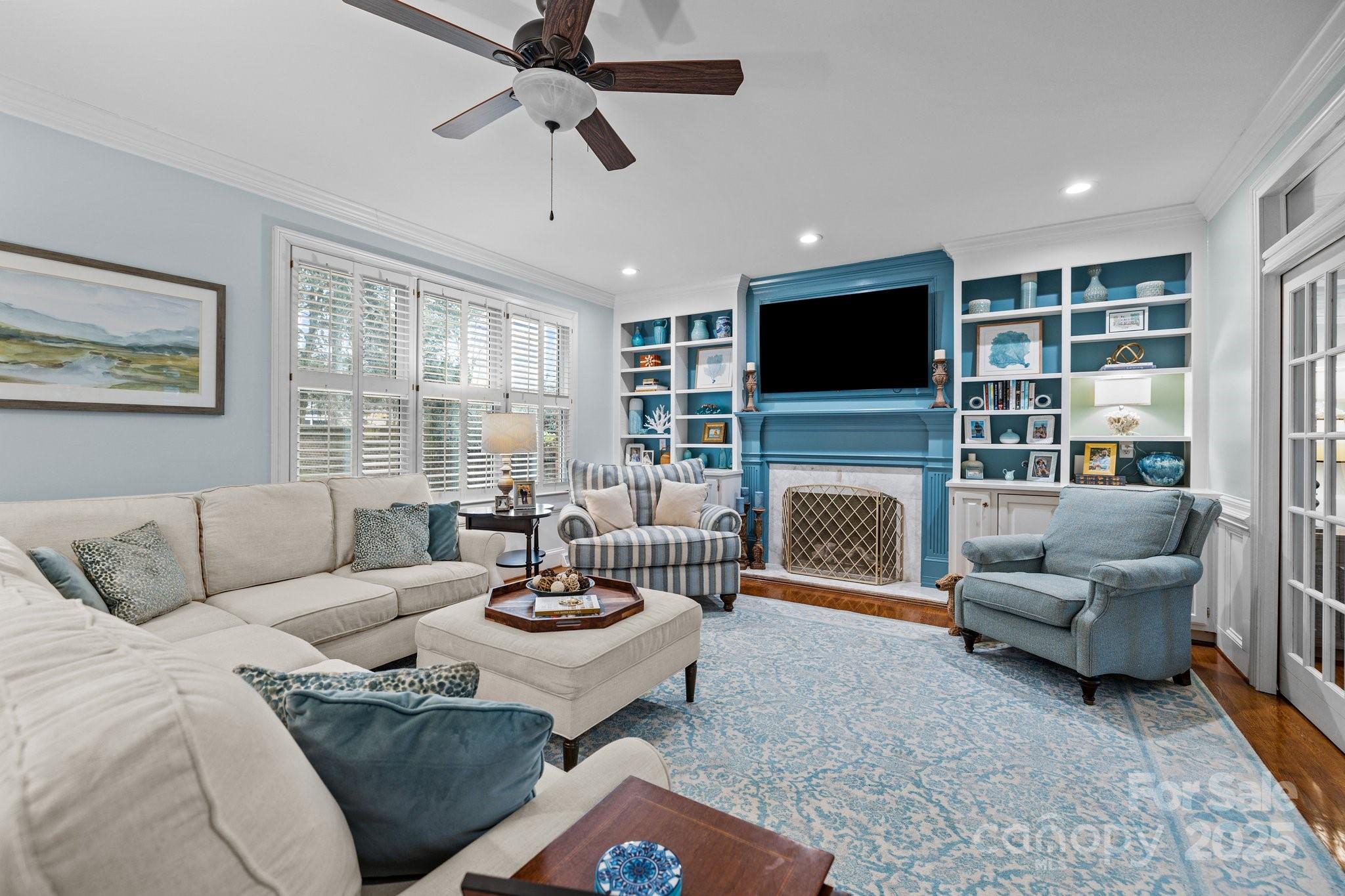 4739 Binfords Ridge Road Charlotte, NC 28226 - Photo 8 of 47 a living room with furniture a fireplace and a flat screen tv