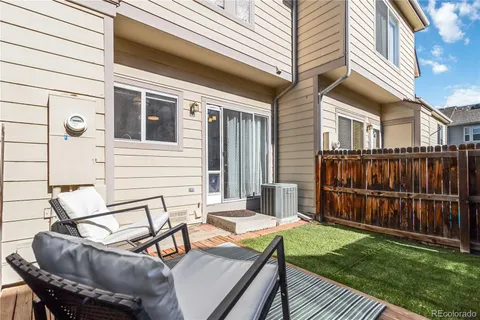 a view of a patio with a table and chairs