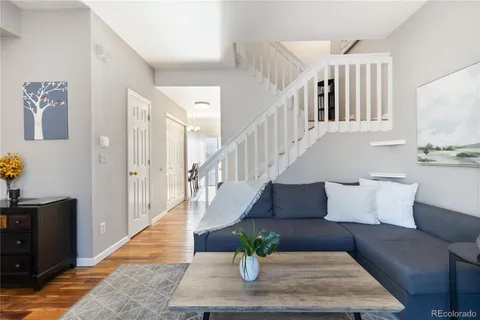 a living room with furniture or couch and a potted plant