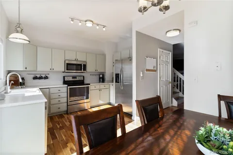 a kitchen with stainless steel appliances a stove refrigerator sink and microwave