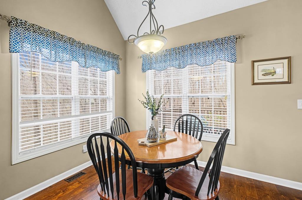 218 Amaranth Court Ball Ground, GA 30107 - Photo 15 of 39 a view of a dining room with furniture window and wooden floor