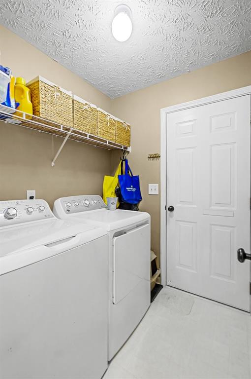 218 Amaranth Court Ball Ground, GA 30107 - Photo 17 of 39 a utility room with dryer and washer