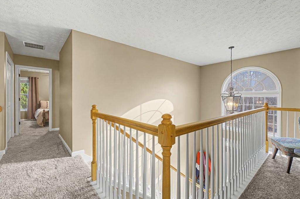 218 Amaranth Court Ball Ground, GA 30107 - Photo 23 of 39 a view of a hallway view with staircase