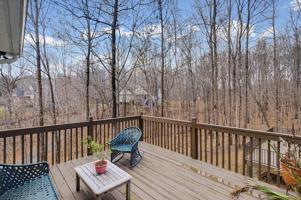 218 Amaranth Court Ball Ground, GA 30107 - Photo 28 of 39 a view of balcony with wooden floor and outdoor seating