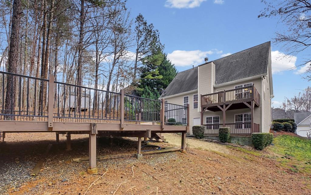 218 Amaranth Court Ball Ground, GA 30107 - Photo 34 of 39 a house view with a sitting space and garden