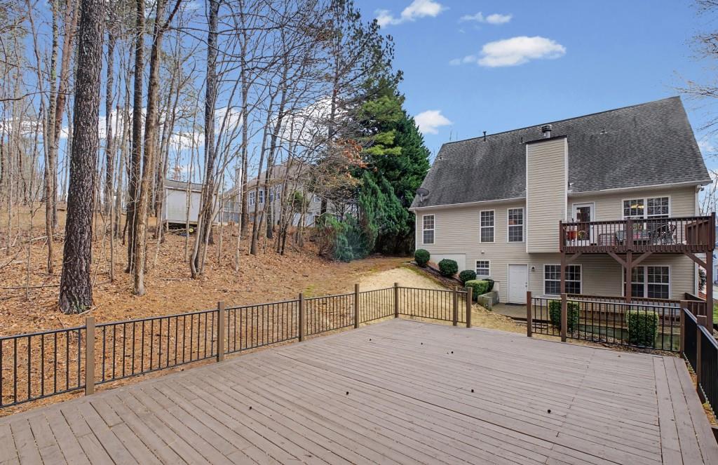 218 Amaranth Court Ball Ground, GA 30107 - Photo 35 of 39 a view of house with deck and outdoor seating