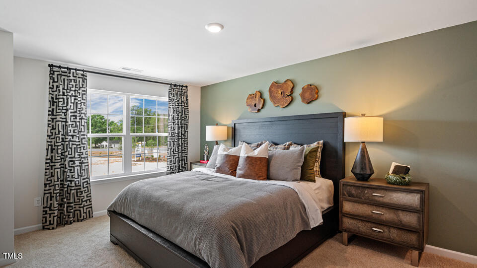 419 Belgian Red Way Wake Forest, NC 27587 - Photo 15 of 30 a bedroom with a bed and a window