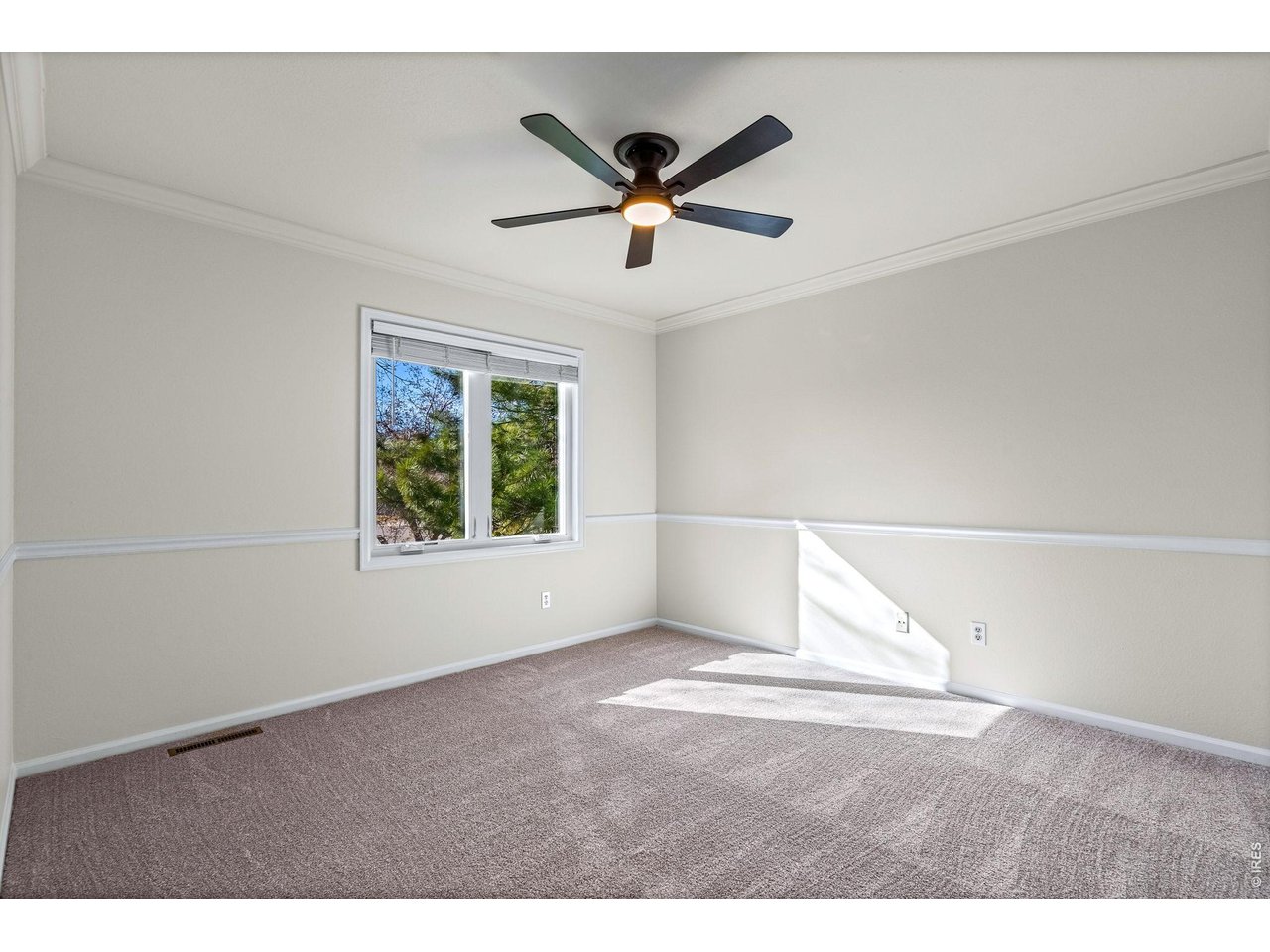 4133 Sumter Square Fort Collins, CO 80525 - Photo 20 of 42 a view of an empty room with a window