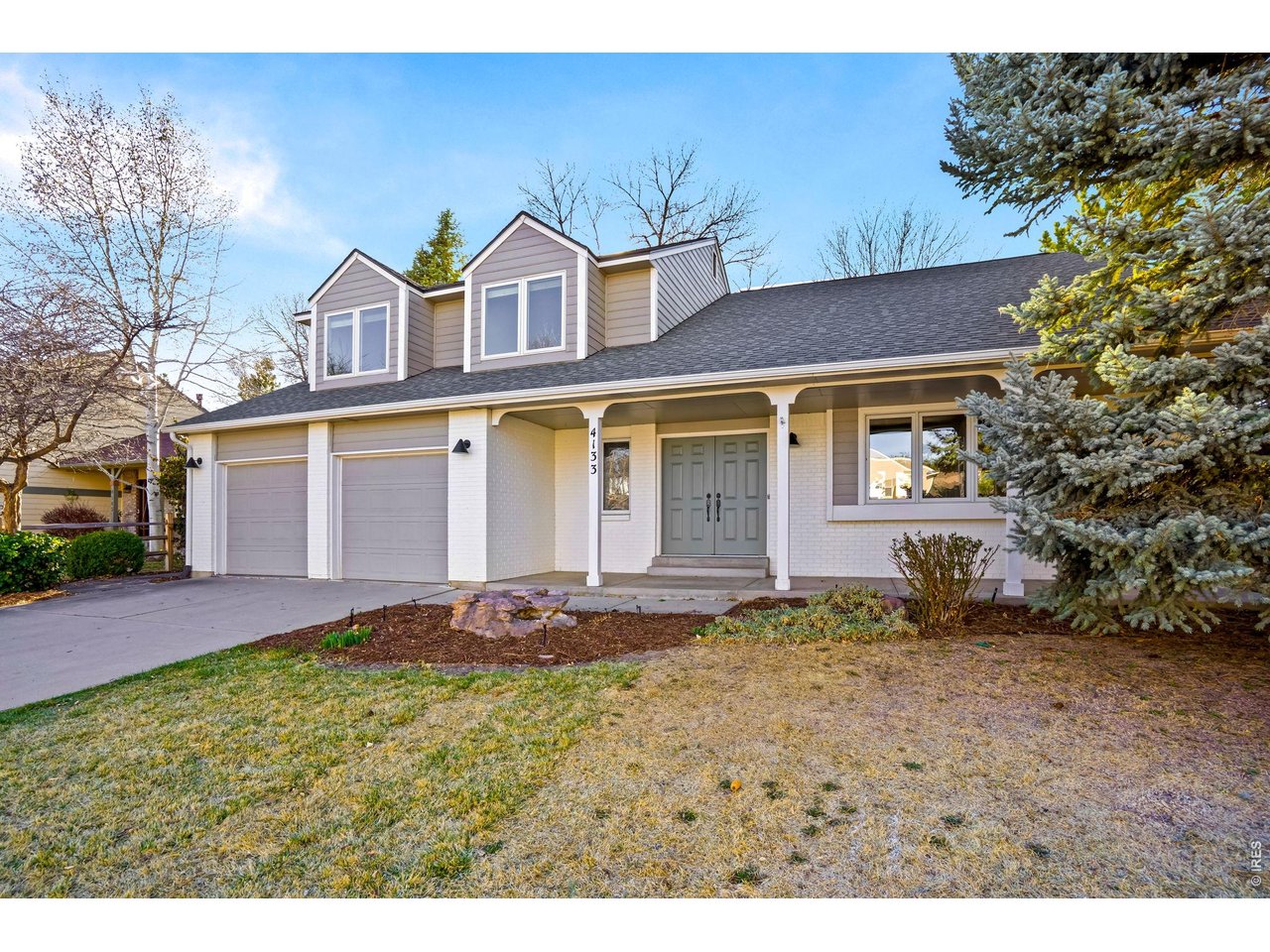 4133 Sumter Square Fort Collins, CO 80525 - Photo 2 of 42 front view of a house with a yard