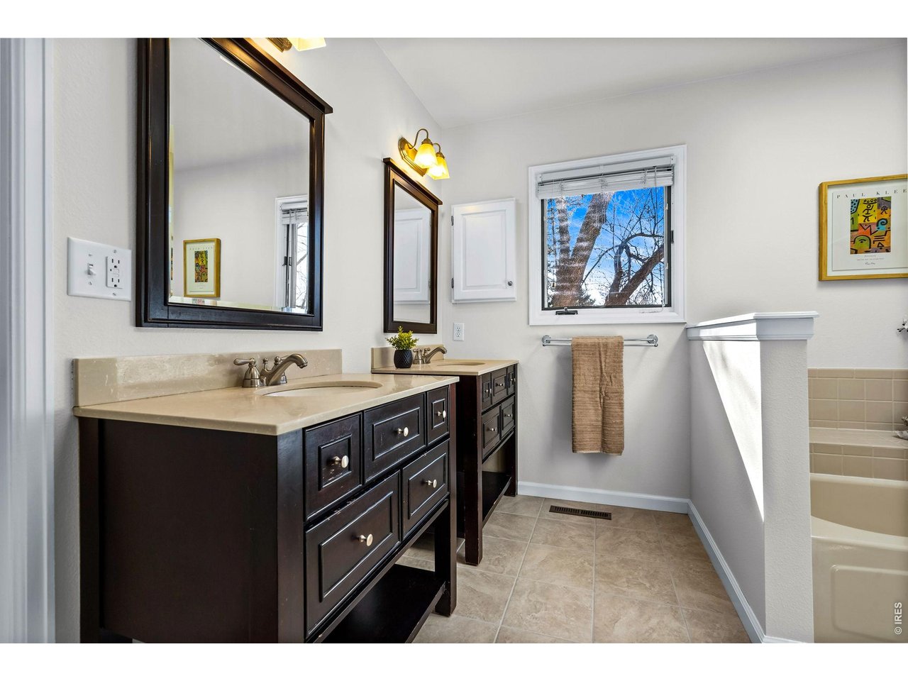4133 Sumter Square Fort Collins, CO 80525 - Photo 27 of 42 a bathroom with a sink and a mirror