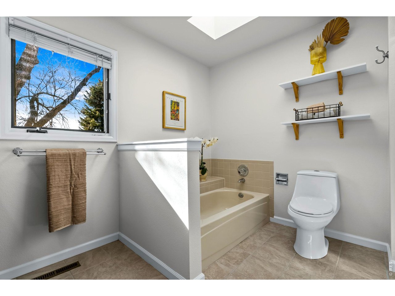 4133 Sumter Square Fort Collins, CO 80525 - Photo 28 of 42 a bathroom with a toilet sink and tub