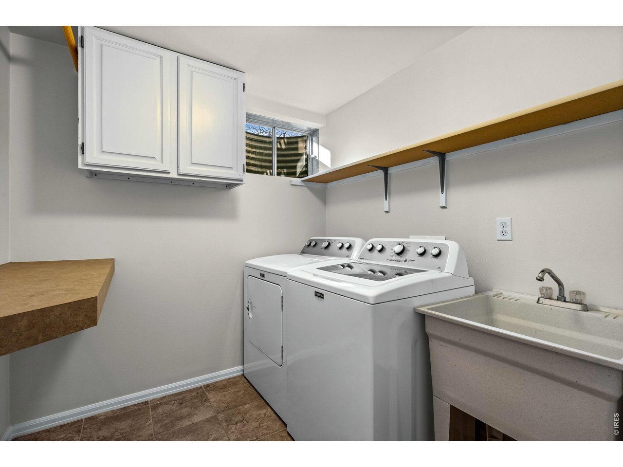 4133 Sumter Square Fort Collins, CO 80525 - Photo 32 of 42 a utility room with dryer and washer